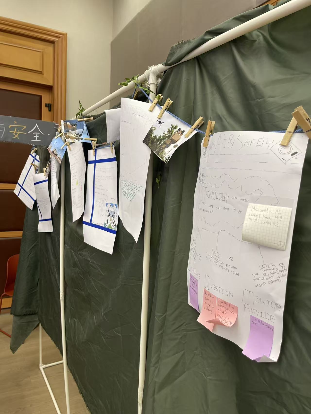 The drones group strung their whole inquiry timeline on a line, so visitors could walk it from first question to final action.